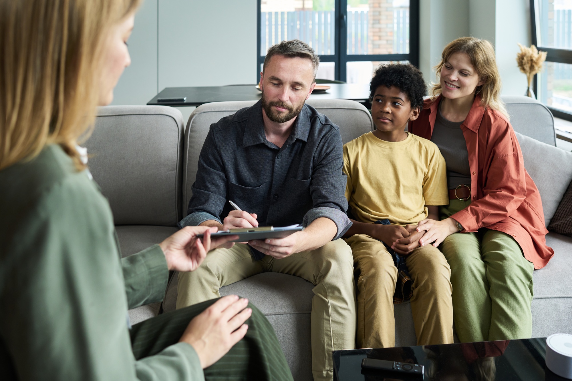 Engaging in Family Therapy Session in Comfortable Setting